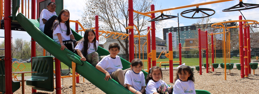 Students posing on the slide
